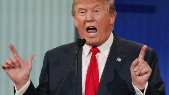 Republican 2016 U.S. presidential candidate businessman Donald Trump answers a question at the first official Republican presidential candidates debate of the 2016 U.S. presidential campaign in Cleveland, Ohio, in this file photo taken August 6, 2015. Trump, disinvited from a conservative conference and under fire because of remarks about a female debate moderator, defended his comments on Saturday while denouncing politically correct "fools." REUTERS/Brian Snyder/Files